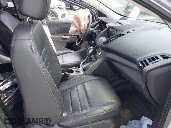 2016 Ford Escape SE with VIN 1FMCU9G92GUC28879, listed as a IAAI auction lot 42021065 with 99,184 mi miles. Bid and sale history available at carsss.com. Image 5.