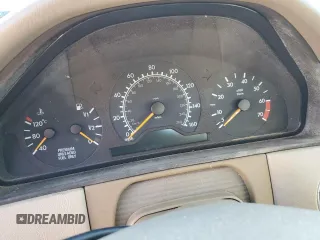 1998 Mercedes-Benz E-Class with VIN WDBJH65F9WA597132, listed as a Copart auction lot 77780094 with 0 mi miles and Salvage Title. Bid and sale history available at carsss.com. Image 9.