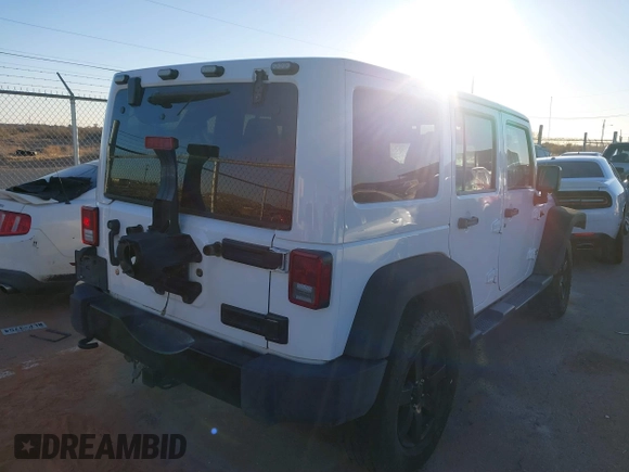 2014 Jeep Wrangler Unlimited Sahara with VIN 1C4BJWEG0EL273475, listed as a IAAI auction lot 41515425 with 128,900 mi miles. Bid and sale history available at carsss.com. Image 4.