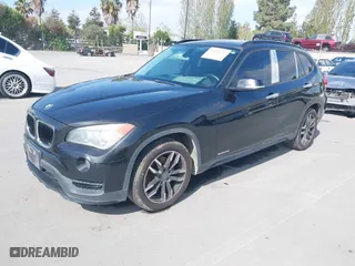 2015 BMW X1 sDrive28i with VIN WBAVM1C59FVW57928, listed as a IAAI auction lot 42056452 with 115,411 mi miles. Bid and sale history available at carsss.com. Image 2.