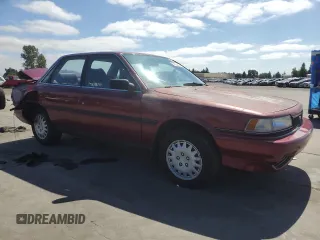 1991 Toyota Camry DLX z VIN 4T1SV21E7MU414824, wystawiony jako Copart lot #61604434 z przebiegiem 170 867 mil mil oraz Szkoda całkowita • Salvage title. Historia ofert i sprzedaży dostępna na DreamBid. Obrazek 4.