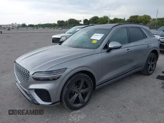 2023 Genesis GV70 Sport with VIN KMUMCDTC1PU098851, listed as a IAAI auction lot 41864774 with 15,016 mi miles and . Bid and sale history available at DreamBid. Image 2.