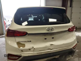 2019 Hyundai Santa Fe SE with VIN 5NMS23AD1KH063472, listed as a IAAI auction lot 41375650 with 64,496 mi miles and . Bid and sale history available at DreamBid. Image 17.