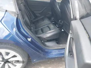 2022 Tesla Model 3 with VIN 5YJ3E1EA7NF188417, listed as a IAAI auction lot 41885623 with 105,457 mi miles and . Bid and sale history available at DreamBid. Image 8.
