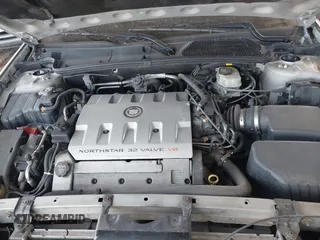 2003 Cadillac DeVille DTS z VIN 1G6KF57943U114611, wystawiony jako IAAI lot #41661350 z przebiegiem 160 762 mil mil oraz . Historia ofert i sprzedaży dostępna na DreamBid. Obrazek 10.