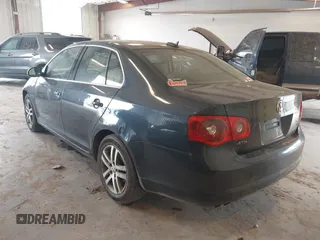 2006 Volkswagen Jetta 1.9L TDI z VIN 3VWDT71K26M624953, wystawiony jako IAAI lot #42420386 z przebiegiem 161 686 mil mil oraz . Historia ofert i sprzedaży dostępna na DreamBid. Obrazek 3.