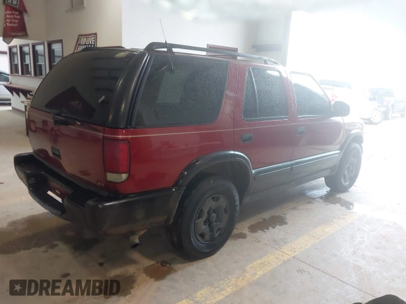 1999 Chevrolet Blazer Trailblazer z VIN 1GNDT13W4X2187490, wystawiony jako IAAI lot #41966073 z przebiegiem 187 604 mil mil oraz . Historia ofert i sprzedaży dostępna na DreamBid. Obrazek 4.