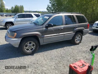 2000 Jeep Grand Cherokee Laredo z VIN 1J4GW48S9YC316673, wystawiony jako Copart lot #54181545 z przebiegiem 201 692 mil mil oraz Szkoda całkowita • Salvage title. Historia ofert i sprzedaży dostępna na DreamBid. Obrazek 1.