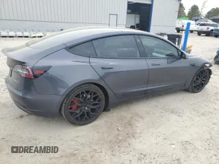2021 Tesla Model 3 Performance with VIN 5YJ3E1EC5MF984986, listed as a Copart auction lot 52010205 with 48,012 mi miles and Salvage Title. Bid and sale history available at DreamBid. Image 3.