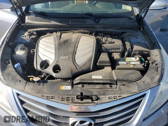 2015 Hyundai Azera z VIN KMHFG4JGXFA483472, wystawiony jako Copart lot #52216745 z przebiegiem 130 758 mil mil oraz Szkoda całkowita • Salvage title. Historia ofert i sprzedaży dostępna na DreamBid. Obrazek 13.