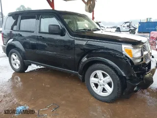 2007 Dodge Nitro SXT with VIN 1D8GT28K67W683600, listed as a IAAI auction lot 40958011 with 70,141 mi miles. Bid and sale history available at carsss.com. Image 1.