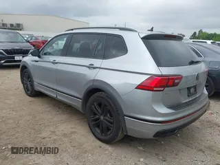 2022 Volkswagen Tiguan SE R-Line Black with VIN 3VVCB7AXXNM165748, listed as a IAAI auction lot 42178772 with 64,007 mi miles and . Bid and sale history available at DreamBid. Image 3.