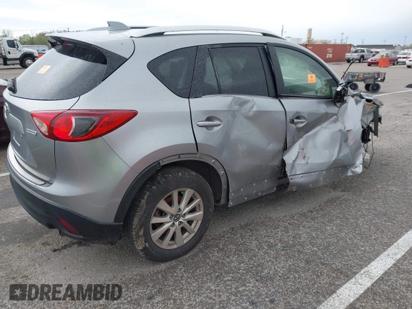 2014 Mazda CX-5 Touring with VIN JM3KE4CY1E0426409, listed as a IAAI auction lot 41924258 with 116,956 mi miles. Bid and sale history available at carsss.com. Image 4.