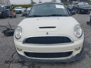 2013 MINI Coupe S with VIN WMWSX3C53DT466648, listed as a IAAI auction lot 41719597 with 106,936 mi miles and . Bid and sale history available at DreamBid. Image 13.