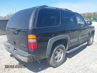 2002 Chevrolet Tahoe LT z VIN 1GNEC13Z42R245581, wystawiony jako IAAI lot #41810788 z przebiegiem 228 166 mil mil oraz . Historia ofert i sprzedaży dostępna na DreamBid. Obrazek 4.