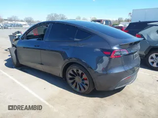2024 Tesla Model Y Performance with VIN 7SAYGDEF1RA329825, listed as a IAAI auction lot 41762602 with 3,923 mi miles and . Bid and sale history available at DreamBid. Image 3.