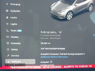 2023 Tesla Model Y Long Range with VIN 7SAYGAEE8PF976969, listed as a IAAI auction lot 41877784 with 25,896 mi miles. Bid and sale history available at carsss.com. Image 16.