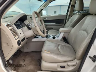 2009 Mercury Mariner Hybrid with VIN 4M2CU29369KJ14719, listed as a Copart auction lot 62511705 with 144,062 mi miles and Salvage title. Bid and sale history available at DreamBid. Image 7.
