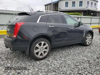 2014 Cadillac SRX Performance Collection with VIN 3GYFNFE33ES687941, listed as a Copart auction lot 57726675 with 164,059 mi miles and Clean title. Bid and sale history available at DreamBid. Image 3.