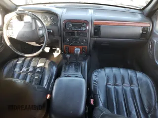 1999 Jeep Grand Cherokee Limited with VIN 1J4GW68N8XC770353, listed as a Copart auction lot 74670614 with Not provided miles and Non repairable. Bid and sale history available at DreamBid. Image 8.