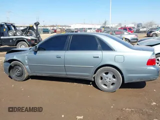 2003 Toyota Avalon XL z VIN 4T1BF28B33U293202, wystawiony jako IAAI lot #41768148 z przebiegiem 157 992 mil mil oraz . Historia ofert i sprzedaży dostępna na DreamBid. Obrazek 14.