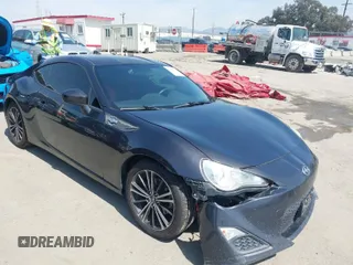 2015 Scion FR-S with VIN JF1ZNAA19F8706096, listed as a IAAI auction lot 41851509 with 124,433 mi miles. Bid and sale history available at carsss.com. Image 1.