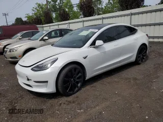 2019 Tesla Model 3 Mid Range z VIN 5YJ3E1EA2KF486532, wystawiony jako Copart lot #58082635 z przebiegiem 51 920 mil mil oraz Tytuł czysty. Historia ofert i sprzedaży dostępna na DreamBid. Obrazek 1.