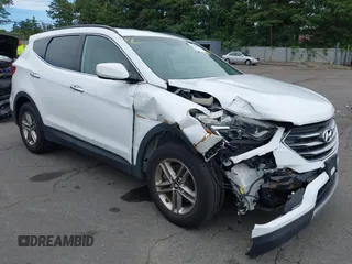 2017 Hyundai Santa Fe 2.4L z VIN 5NMZUDLB1HH035769, wystawiony jako IAAI lot #42764052 z przebiegiem 73 139 mil mil oraz . Historia ofert i sprzedaży dostępna na DreamBid. Obrazek 1.