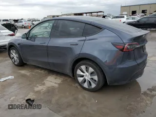 2023 Tesla Model Y Long Range with VIN 7SAYGDEE3PA151887, listed as a Copart auction lot 51459495 with 15,562 mi miles and Salvage Title. Bid and sale history available at DreamBid. Image 2.