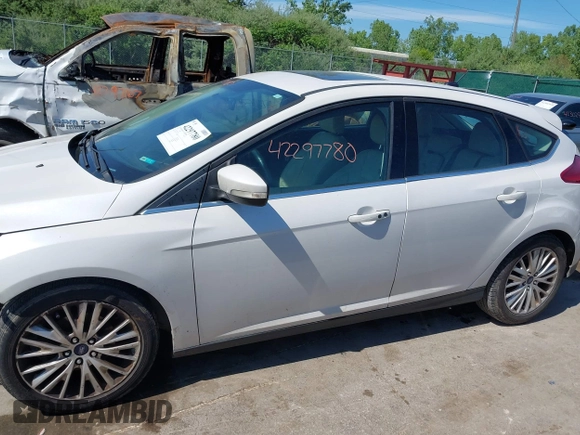 2018 Ford Focus Titanium with VIN 1FADP3N24JL279449, listed as a IAAI auction lot 42297780 with 144,479 mi miles and . Bid and sale history available at DreamBid. Image 14.
