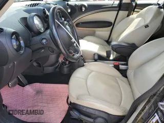 2013 MINI Countryman S ALL4 z VIN WMWZC5C56DWP33270, wystawiony jako Copart lot #56804085 z przebiegiem 141 637 mil mil oraz Szkoda całkowita • Salvage title. Historia ofert i sprzedaży dostępna na DreamBid. Obrazek 7.