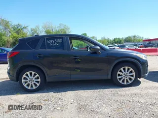 2013 Mazda CX-5 Grand Touring with VIN JM3KE4DE6D0127601, listed as a IAAI auction lot 42143558 with 95,719 mi miles and . Bid and sale history available at DreamBid. Image 13.