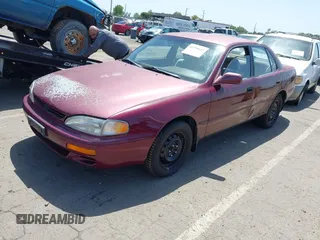 1996 Toyota Camry LE with VIN 4T1BF12K1TU129000, listed as a IAAI auction lot 42294535 with 157,851 mi miles and . Bid and sale history available at DreamBid. Image 2.