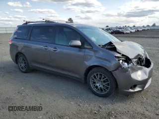 2011 Toyota Sienna XLE with VIN 5TDDK3DC2BS028058, listed as a Copart auction lot 54374215 with 216,905 mi miles and Salvage Title. Bid and sale history available at DreamBid. Image 4.