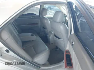 2006 Toyota Camry LE z VIN 4T1BF30K96U115963, wystawiony jako IAAI lot #41616833 z przebiegiem 237 404 mil mil oraz . Historia ofert i sprzedaży dostępna na DreamBid. Obrazek 8.