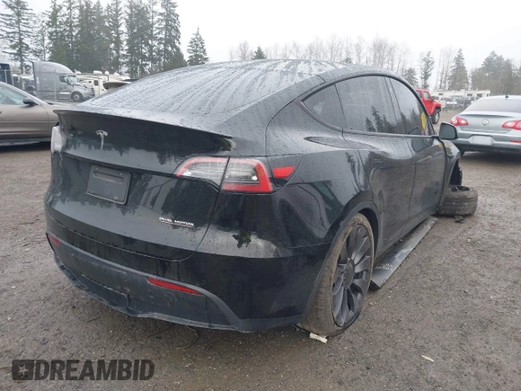 2021 Tesla Model Y Performance z VIN 5YJYGDEF2MF215938, wystawiony jako IAAI lot #41338287 z przebiegiem 63 925 mil mil oraz . Historia ofert i sprzedaży dostępna na DreamBid. Obrazek 4.