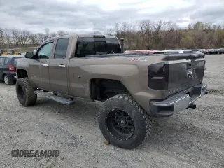 2014 Chevrolet Silverado 1500 LTZ with VIN 1GCVKSEC0EZ140325, listed as a Copart auction lot 52954845 with 128,231 mi miles and Salvage Title. Bid and sale history available at DreamBid. Image 2.