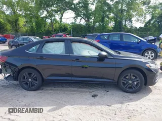 2024 Volkswagen Jetta SE with VIN 3VW7M7BU1RM063918, listed as a IAAI auction lot 42233127 with 12,903 mi miles and . Bid and sale history available at DreamBid. Image 14.