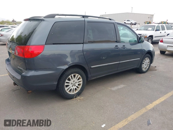 2009 Toyota Sienna XLE with VIN 5TDBK22C19S027059, listed as a IAAI auction lot 42105532 with 241,532 mi miles. Bid and sale history available at carsss.com. Image 4.