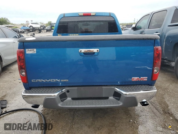 2012 GMC Canyon SLE1 with VIN 1GTD5MF9XC8115453, listed as a Copart auction lot 71113284 with 94,843 mi miles and Salvage Title. Bid and sale history available at carsss.com. Image 6.