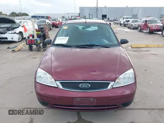 2007 Ford Focus S z VIN 1FAFP31N27W231884, wystawiony jako IAAI lot #41138534 z przebiegiem 84 506 mil mil oraz . Historia ofert i sprzedaży dostępna na DreamBid. Obrazek 13.