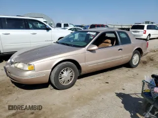 1996 Mercury Cougar z VIN 1MELM62W4TH633336, wystawiony jako Copart lot #75253154 z przebiegiem 162 814 mil mil oraz Szkody całkowita. Historia ofert i sprzedaży dostępna na DreamBid. Obrazek 1.