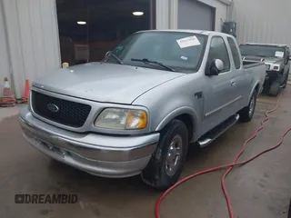 2003 Ford F-150 XL with VIN 2FTRX17223CA73626, listed as a IAAI auction lot 42027926 with 127,614 mi miles. Bid and sale history available at carsss.com. Image 2.