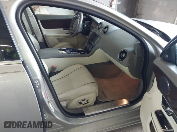 2013 Jaguar XJ Portfolio with VIN SAJWJ2GD0D8V50948, listed as a IAAI auction lot 42067884 with 110,053 mi miles and . Bid and sale history available at DreamBid. Image 5.