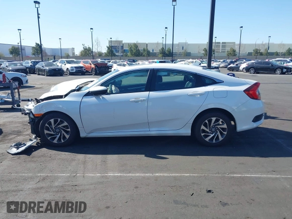 2018 Honda Civic EX with VIN 2HGFC2F71JH502564, listed as a IAAI auction lot 41933157 with 56,696 mi miles and . Bid and sale history available at DreamBid. Image 14.