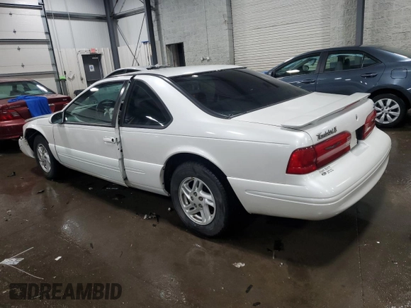 1997 Ford Thunderbird LX with VIN 1FALP6249VH167869, listed as a Copart auction lot 86851434 with 40,490 mi miles and Salvage Title. Bid and sale history available at DreamBid. Image 2.