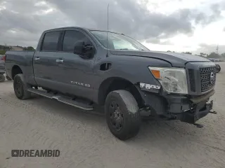 2016 Nissan Titan S with VIN 1N6BA1F14GN517646, listed as a Copart auction lot 55381575 with 147,654 mi miles and Salvage title. Bid and sale history available at DreamBid. Image 4.