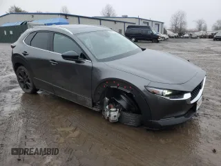 2023 Mazda CX-30 Premium with VIN 3MVDMBDYXPM555206, listed as a Copart auction lot 88027515 with 8,532 mi miles and Salvage title. Bid and sale history available at DreamBid. Image 4.