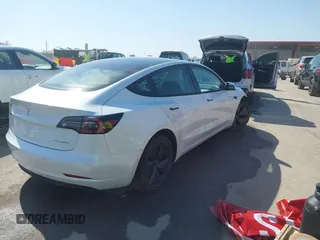 2021 Tesla Model 3 Long Range z VIN 5YJ3E1EB0MF860289, wystawiony jako IAAI lot #41771854 z przebiegiem 190 892 mil mil oraz . Historia ofert i sprzedaży dostępna na DreamBid. Obrazek 4.