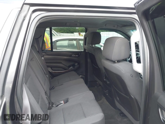 2015 Chevrolet Tahoe LS with VIN 1GNSCAKC0FR245826, listed as a IAAI auction lot 42282590 with 164,208 mi miles and . Bid and sale history available at DreamBid. Image 8.